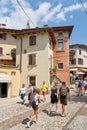 Tourists in an alley in the popular resort of Malcesine in Italy