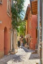 Tourists in an alley in the popular resort of Malcesine in Italy