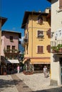 Tourists in the alleys of the popular old town of Malcesine on Lake Garda