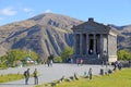 Tourists at Ancient hellenistic Garni pagan Temple in Armenia