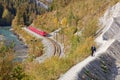 Tourists approaching Isla and observing passing by Glacier Express