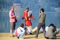 Tourists around a snake charmer in Nepal