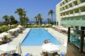 Tourists around the swimming pool in Louis Imperial Beach hotel Royalty Free Stock Photo