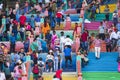 Tourists ascend the colorful stairs of the Batu Caves