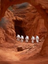 Tourists and astronauts exploring a Martian cave for research and exploration. A diverse group walks along a winding pathway in