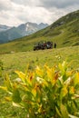 Tourists on ATV and SSV in Caucasus mountains in Arkhyz resort. Quad bike and buggy extreme travel adventure and nature