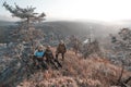 Tourists on the background of a panorama of the South Ural taiga at dawn