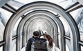 Tourists with backpack going up tunnel escalator in Umeda Sky building in Osaka, Japan Royalty Free Stock Photo
