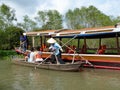 Tourists on a bamboo boat in the Mekong river delta