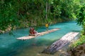 Tourists on bamboo raft ride on Martha Brae River Royalty Free Stock Photo