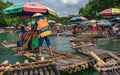 Tourists on bamboo rafts on Yulong River in Yangshuo