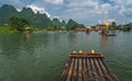 Tourists on bamboo rafts on Yulong River in Yangshuo