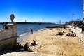 Tourists on the banks of Tagus river in Lisbon