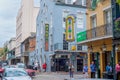 Tourists and Bars on Bourbon Street in the French Quarter Royalty Free Stock Photo