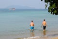 Tourists bathing on the beach in Krabi, southern Thailand