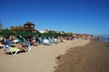 Tourists on the beach, Elviria. Royalty Free Stock Photo