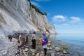 Tourists at the beach of Mons Klint chalk cliffs in Denmark