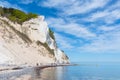 Tourists at the beach of Mons Klint chalk cliffs