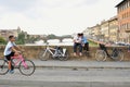 Italian residents and tourists on bikes on the streets of Florence city , Italy Royalty Free Stock Photo