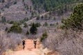 Tourists mountain biking in Colorado Red Rocks Open Space park