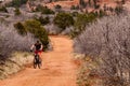 Tourists mountain biking in Colorado Red Rocks Open Space park