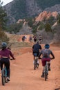 Tourists mountain biking in Colorado Red Rocks Open Space park