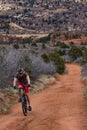 Tourists mountain biking in Colorado Red Rocks Open Space park
