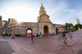 Tourists biking around the clock tower in Cartagena.