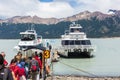 Tourists boarding the boat to watch the Perito Moreno Glacier in Lago Argentino. El Calafate, Patagonia Argentina.