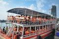 Tourists boarding a sightseeing boat, Pattaya