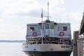 Tourists are boarding the Statue Cruises boat.