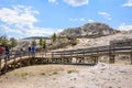 YELLOWSTONE NATIONAL PARK, WYOMING, USA - JULY 17, 2017: Tourists on boardwalk at Palette Spring area, Mammoth Hot Springs Terrace