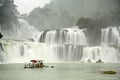 Tourists at the boat close to Ban Gioc Waterfall, Vietnam Royalty Free Stock Photo