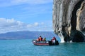 Tourists in a boat in front of Capillas de MÃÂ¡rmol rock formations, Chile