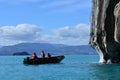 Tourists in a boat in front of Capillas de MÃÂ¡rmol rock formations, Chile