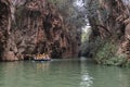 Tourists on a boat in the river in the Jiuxiang scenic area in Yunnan in China. Thee Jiuxiang caves area is near the Stone Forest