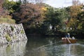 Tourists in a boat and watch beautiful autumn leave around Himej