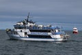 Tourists on a Boat at Whale Watching in Reykjavik. Iceland