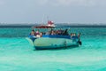 Tourists on a boat at wild Stingray city on Gran Cayman, Cayman islands
