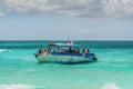 Tourists on a boat at wild Stingray city on Gran Cayman, Cayman islands