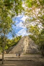 Tourists at the botom of Coba pyramid