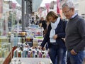 Tourists are browsing books that are sold outdoors