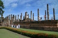 Tourists and Buddha in Wat Mahathat or Mahathat Temple in Sukhothai Historical Park in Thailand. The temple`s name translates to ` Royalty Free Stock Photo