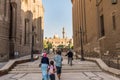 Tourists at the Building of Mosque of Madrassa of Sultan Hassan and the Mosque of Al Rifai in downtown of Cairo Royalty Free Stock Photo