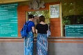Tourists buy ticket for enter to the temple in Lombok, Indonesia