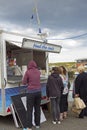 Tourists buying seals food in Eyemouth in Scotland.07.08.2015