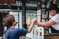 Tourists buying Trdelnik in Prague, Czech Republic