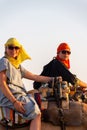 Tourists on a camel in the Sahara desert