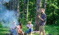 Tourists with camera relaxing checking photos. Company having hike picnic nature background. Summer hike. Hikers sharing Royalty Free Stock Photo