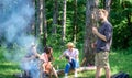 Tourists with camera relaxing checking photos. Company having hike picnic nature background. Summer hike. Picnic with Royalty Free Stock Photo